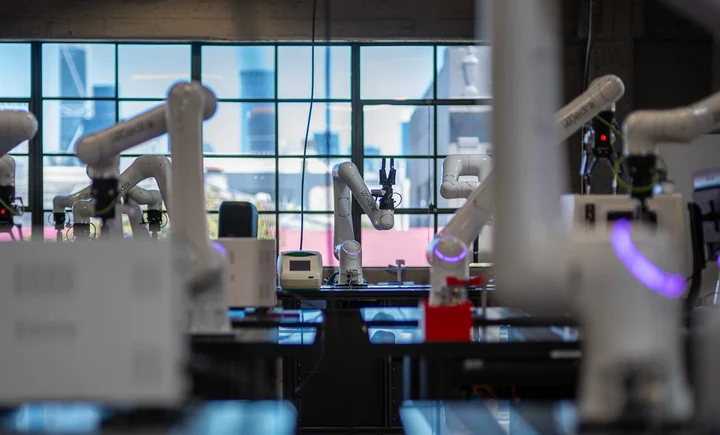 Robot arms in a daylit laboratory